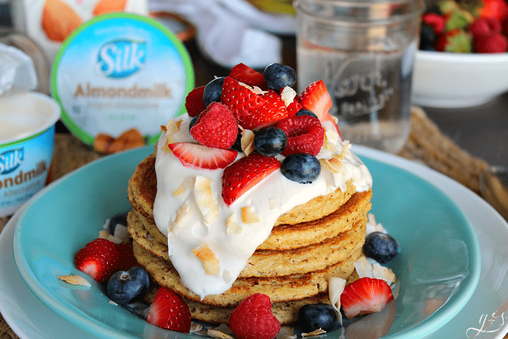 The BEST Coconut Cake Pancakes | This clean eating homemade recipe makes the perfect breakfast that tastes like your favorite cake. These easy Paleo flapjacks and creamy syrup are dairy-free, soy-free, healthy, and gluten free! #ProgressIsPerfection with Silk Almondmilk and yogurts. Transition to a more plant-based diet and away from dairy with these coconut and almond flour pancakes. Plus the only sweetener used is 1 Tbsp of coconut sugar in the ENTIRE recipe! #lowcarb #CBias #CollectiveBias
