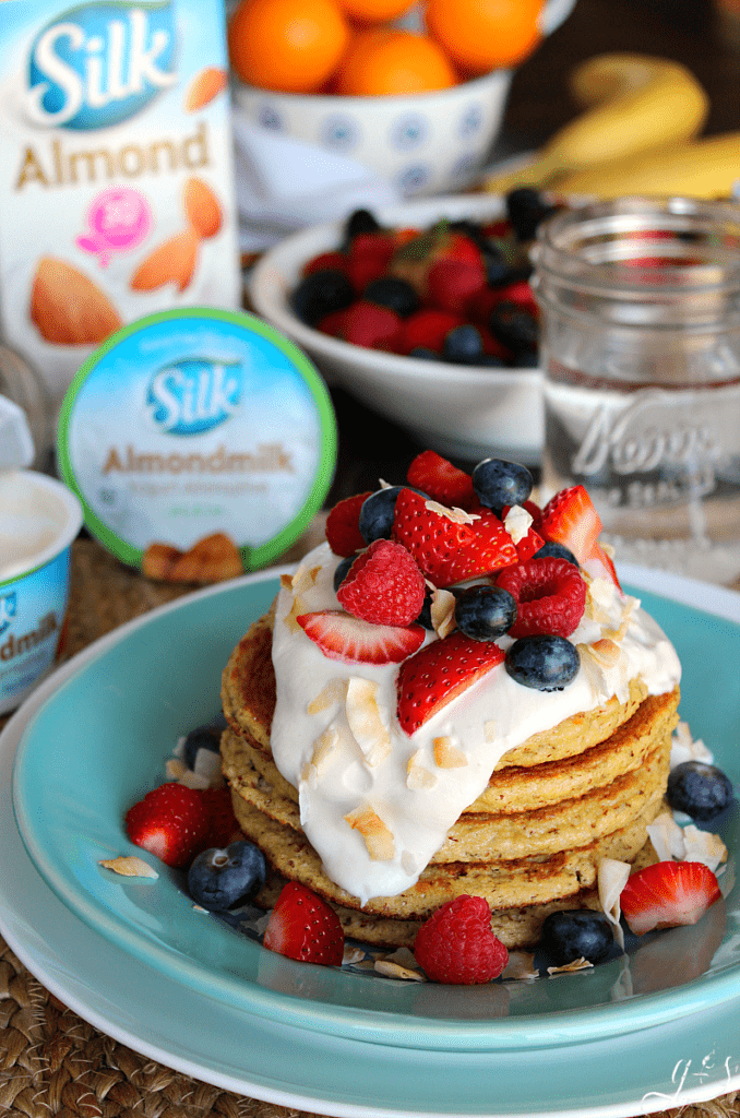 The BEST Coconut Cake Pancakes | This clean eating homemade recipe makes the perfect breakfast that tastes like your favorite cake. These easy Paleo flapjacks and creamy syrup are dairy-free, soy-free, healthy, and gluten free! #ProgressIsPerfection with Silk Almondmilk and yogurts. Transition to a more plant-based diet and away from dairy with these coconut and almond flour pancakes. Plus the only sweetener used is 1 Tbsp of coconut sugar in the ENTIRE recipe! #lowcarb #CBias #CollectiveBias