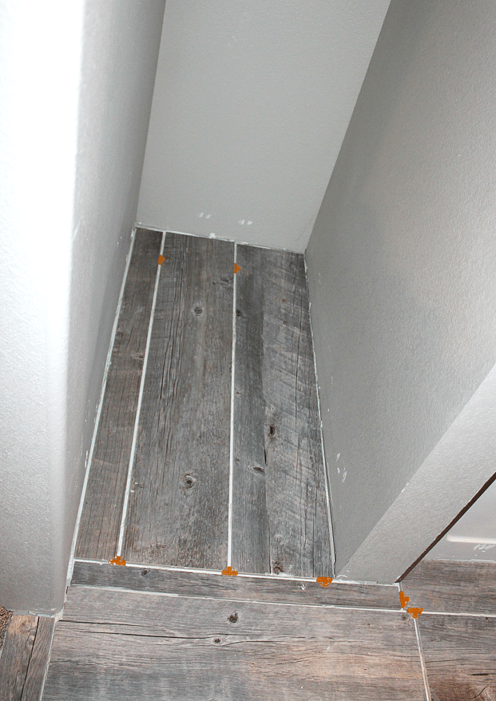 Long tile planks in open linen closet.
