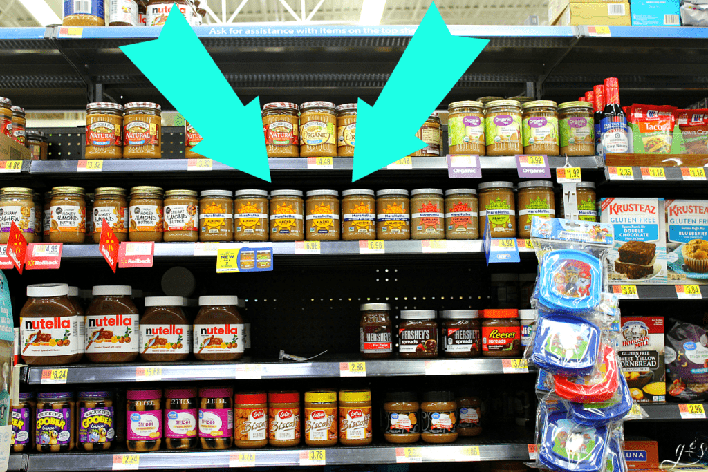 A photo of MaraNatha Almond Butters on the shelf at Wal-Mart with the other nut butters, honey, and jellies.