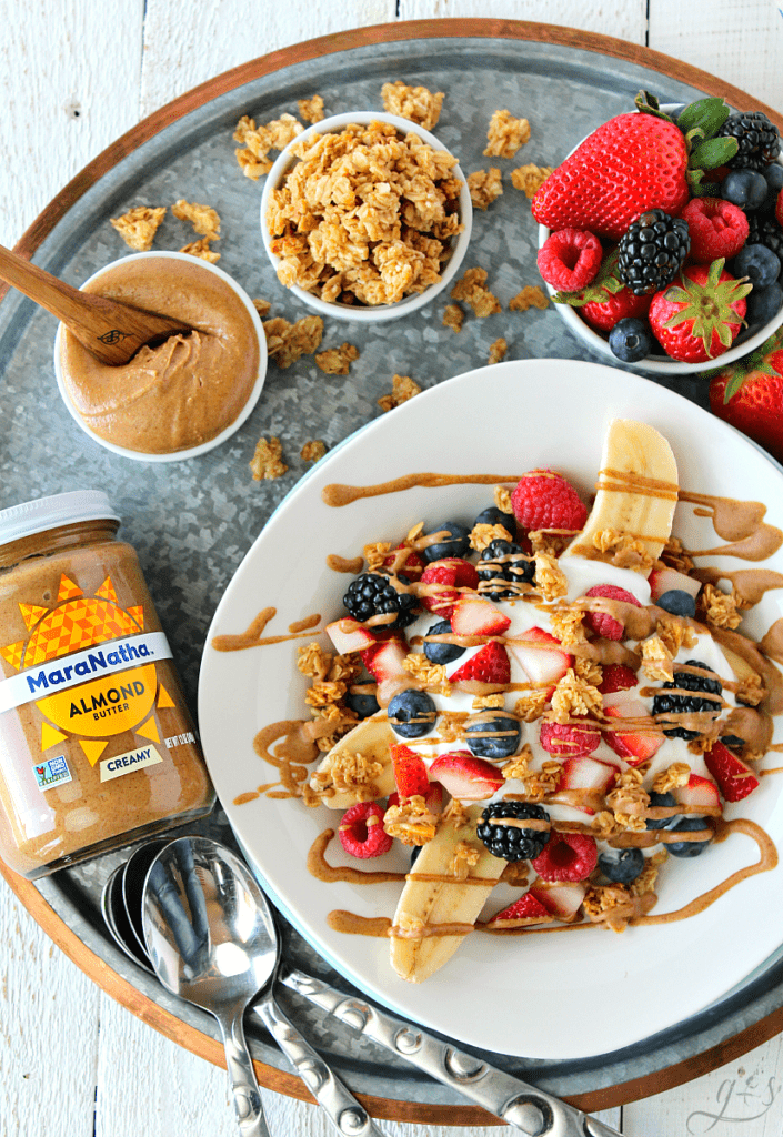 The BEST Breakfast Banana Split | This healthy, easy, and clean eating recipe makes the perfect breakfast or snack. MaraNatha Almond Butters pair perfectly with protein-packed plain Greek yogurt, tasty fruit, and gluten-free granola! Kids and adults will love this for a fun dessert too, maybe add a few chocolate chips! If you need a break from eggs, smoothies, and oats try this low carb weight loss idea to kick up your mornings! #StartAHealthyRelationship #AD #CollectiveBias #breakfast 