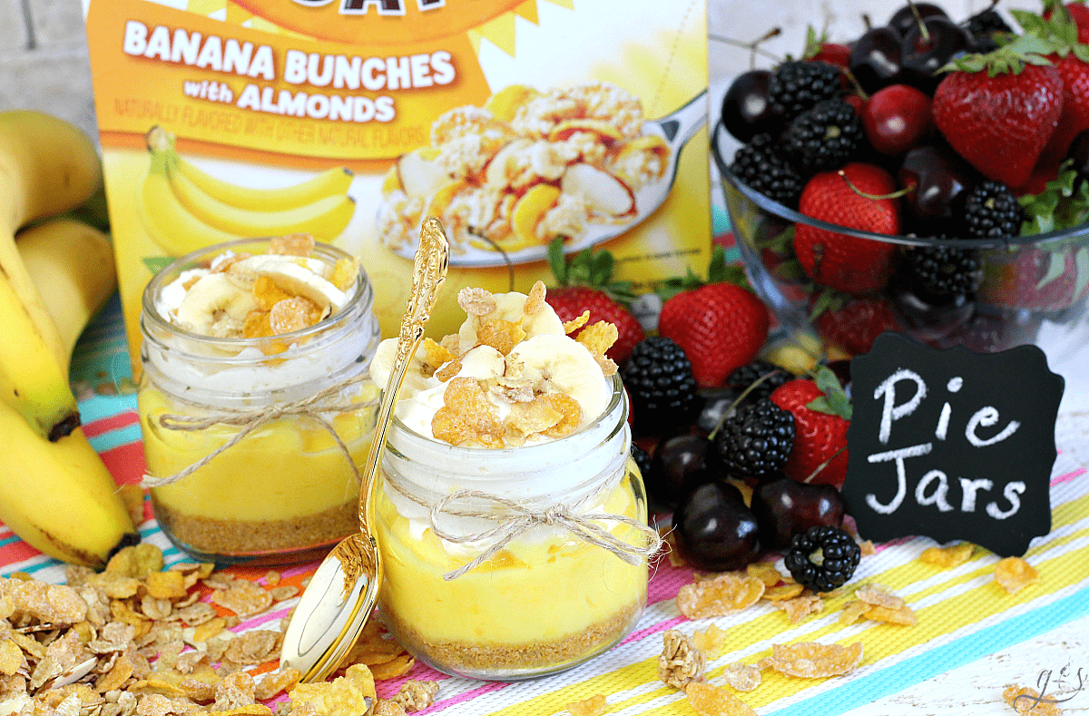 Colorful presentation of Honey Bunches of Oats Banana Bunches used as pie crust in mason jars. 