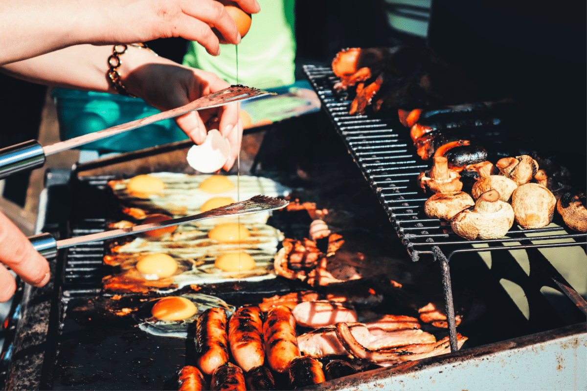 Eggs and sausage on a grill. Fall Bucket List for Foodies