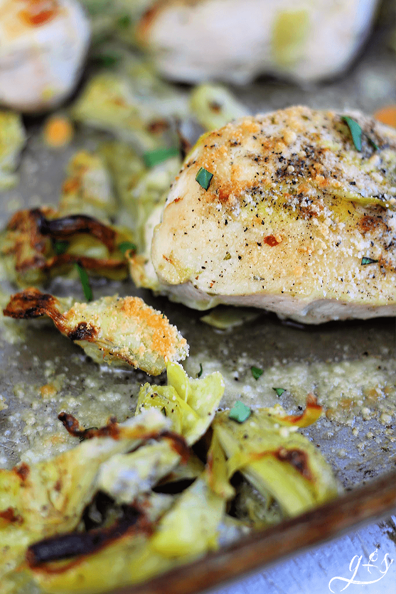 4 Ingredient Chicken & Artichoke Sheet Pan Dinner | Easy meals are just the ticket on busy weeknights. I will show you how to make this simple chicken and artichoke family dinner with only one pan and bowl. This recipe is low carb, clean eating, gluten free, and healthy. Choose chicken breasts or thighs, marinated artichoke hearts, and Parmesan cheese. Look no further for easy dinner ideas here at G&S! #weeknightmeals #chicken #dinner #cleaneating #easyrecipe 