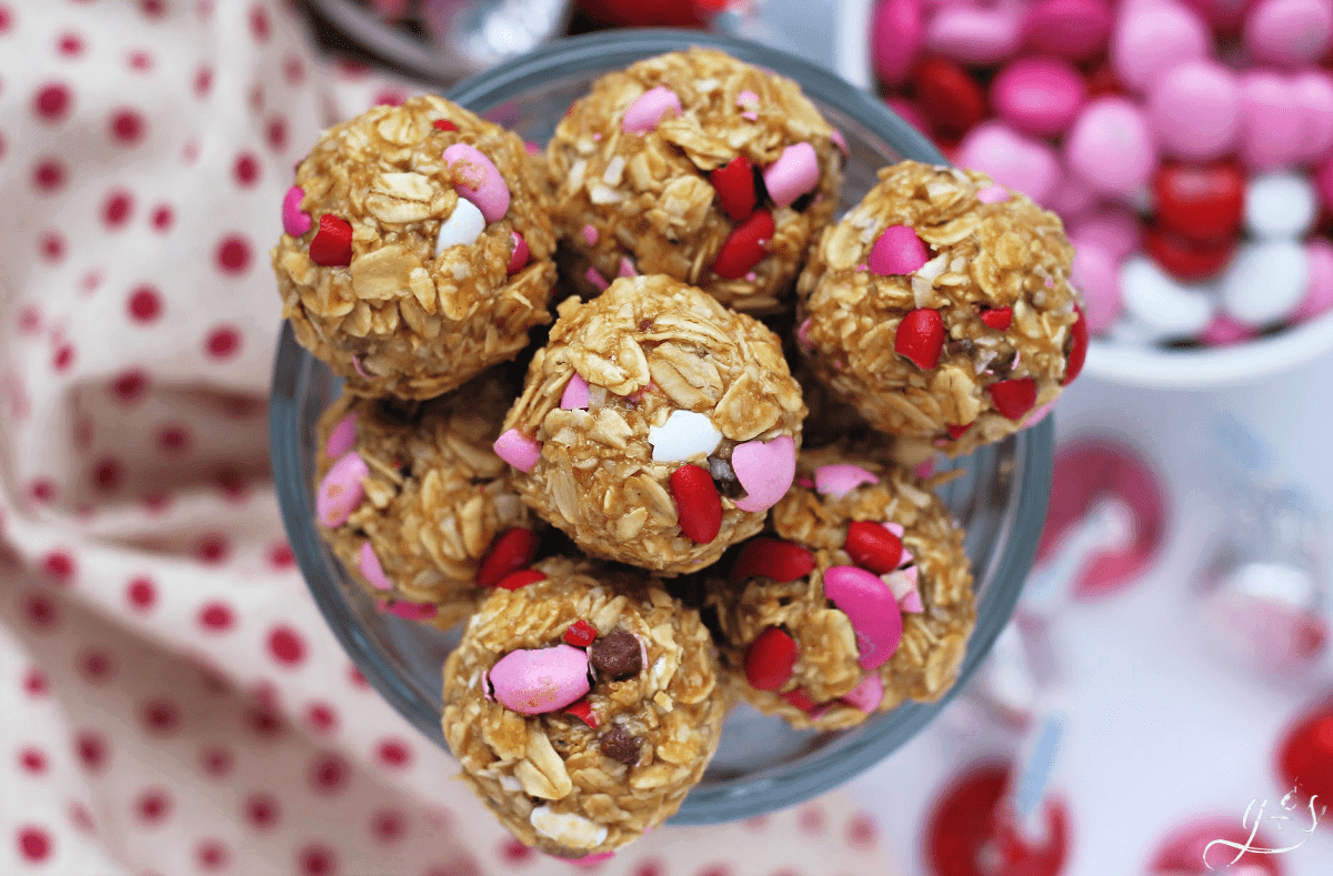 Round gluten free no bake Valentine energy balls made with oats, M&Ms and flaxseed.