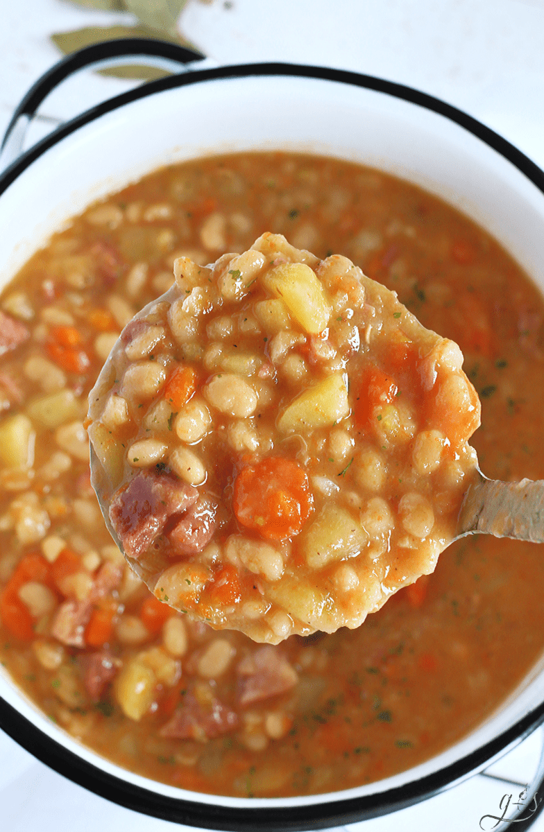 The BEST Instant Pot Ham & Bean Soup | This healthy and easy dinner recipe is a crowd pleaser for families. Use your pressure cooker for 1 hour 15 minutes or your slow cooker (crockpot) for 6 hours on high. A leftover ham bone, meat, water, and veggies make for cooking a quick and thick soup. Gluten free crock pot and comfort foods recipes are the best, aren't they?! Serve this with a hearty bread or simple rolls! #healthyrecipes #instantpot #easyrecipe #glutenfree