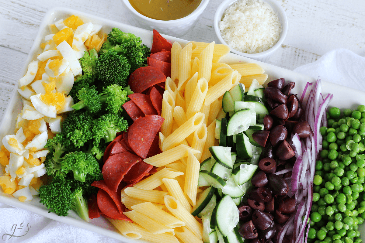 Close up shot of a tray of ingredients for a salad with chickpea pasta.