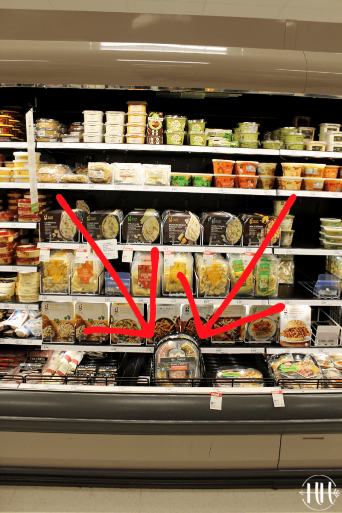 Refrigerated section of Target highlighting snack trays of meat and cheese. 