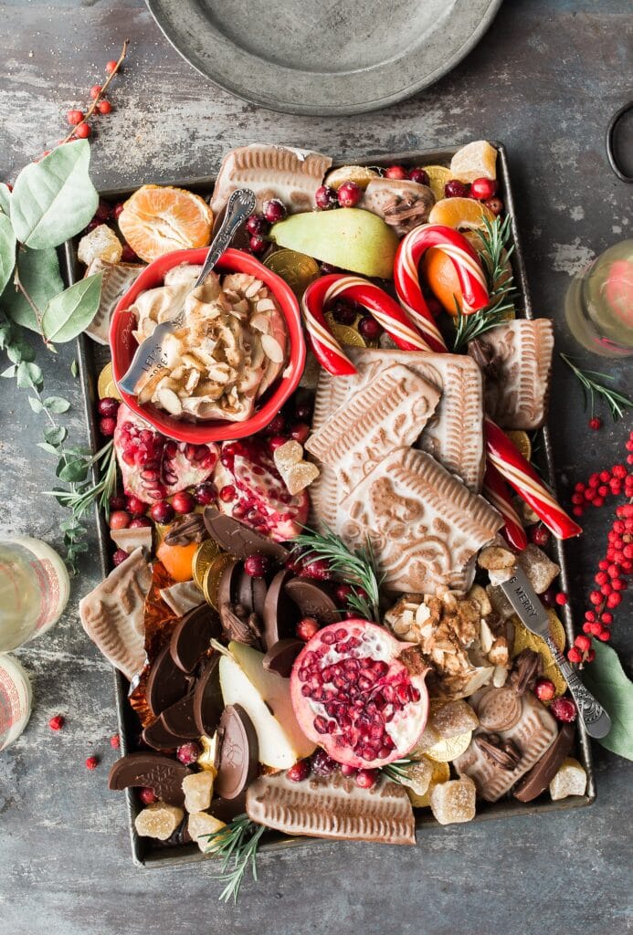 Holiday charcuterie board with delicious food for Christmas dinner meal prep.