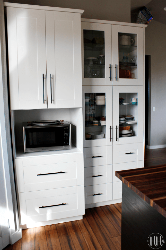 IKEA microwave cabinet and two skinny cabinets with GRIMSLOV glass doors. 