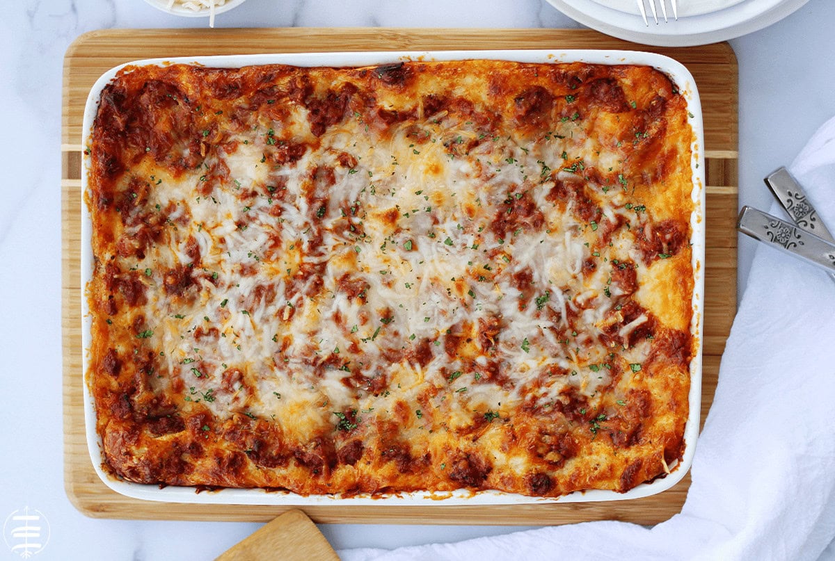 A pan of baked lasagna in a white pan.