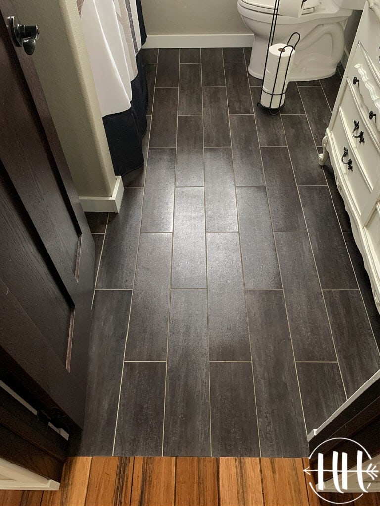 Black Luxury Vinyl Plank Tile Flooring in a bathroom. 