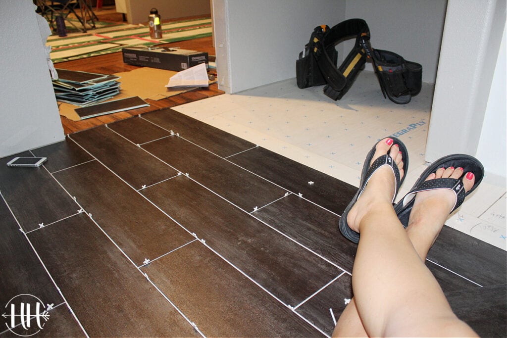 Luxury vinyl plank flooring with 1/8" spacers in a bathroom. 