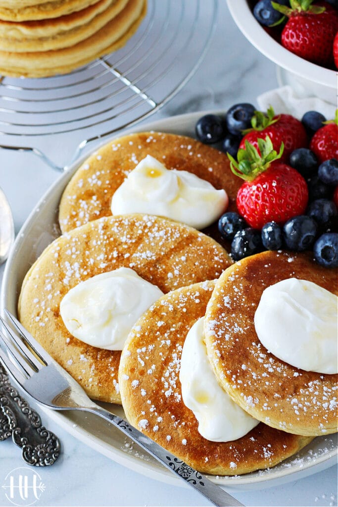 Gluten free pancakes with plain Greek yogurt and berries.