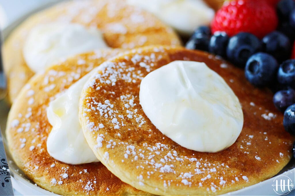 Dollop of Greek yogurt on protein pancakes. 