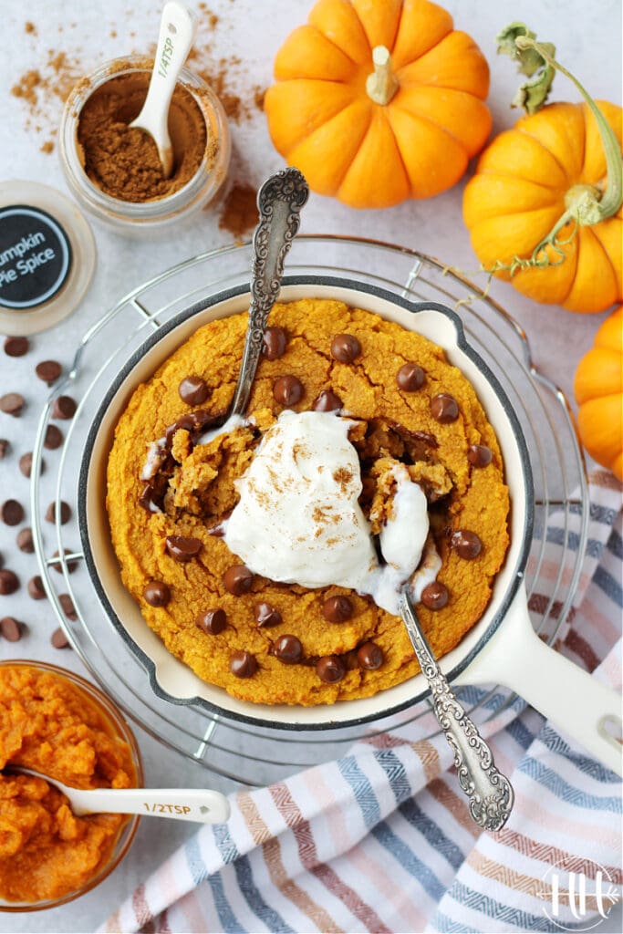 Vegetarian autumn cake for one baked with fall spices and topped with Lily's salted caramel chocolate chips. 