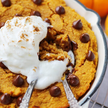 Up close photo of two spoons digging into a protein pumpkin cake.