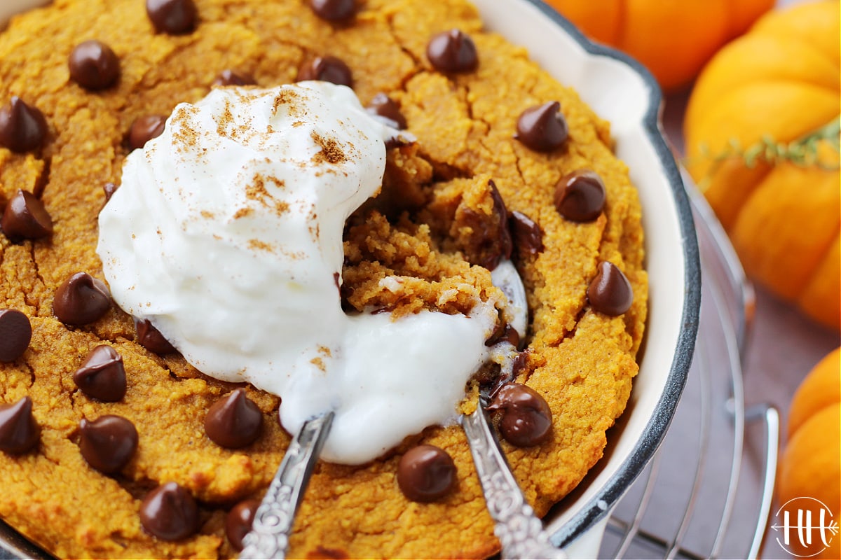 Up close photo of two spoons digging into a protein pumpkin cake.