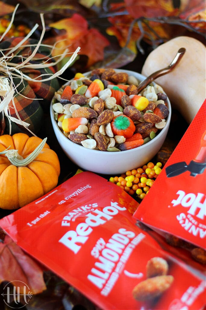 Friendsgiving Appetizer Menu Ideas like this cute bowl of fall snack mix using Frank's Red Hot Sauce Almonds. 