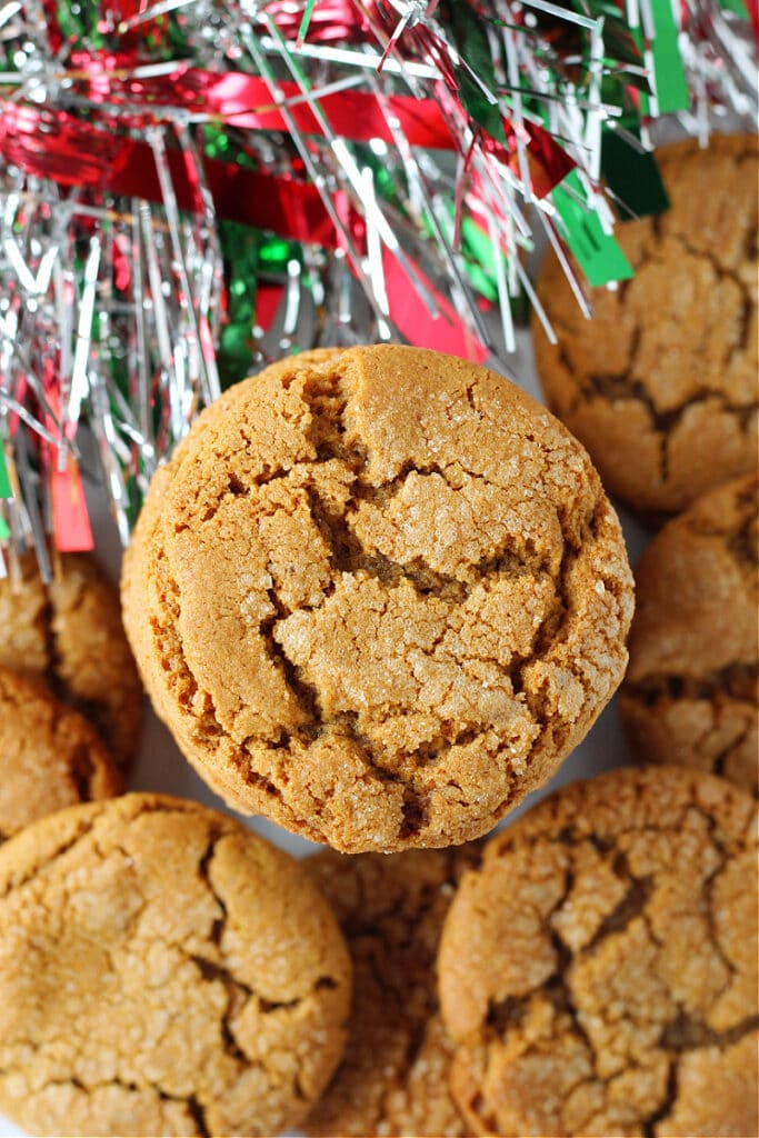 Pretty Molasses Crinkles Cookies complete with holiday garland in the background. 