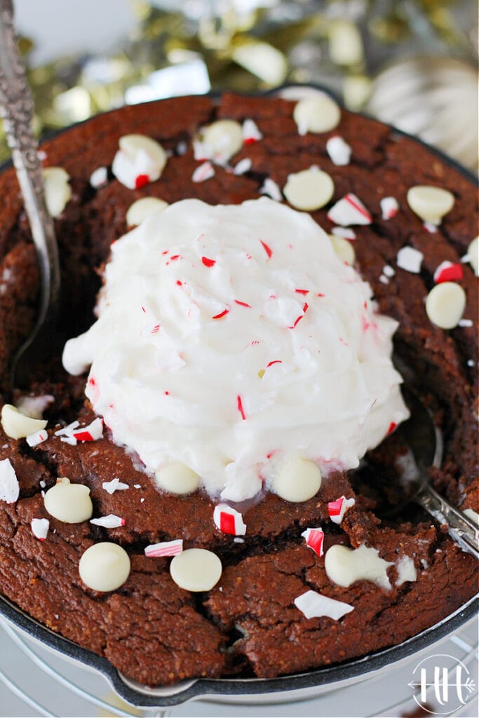 Holiday flavored cake topped with white chocolate peppermint chips and candy canes. 
