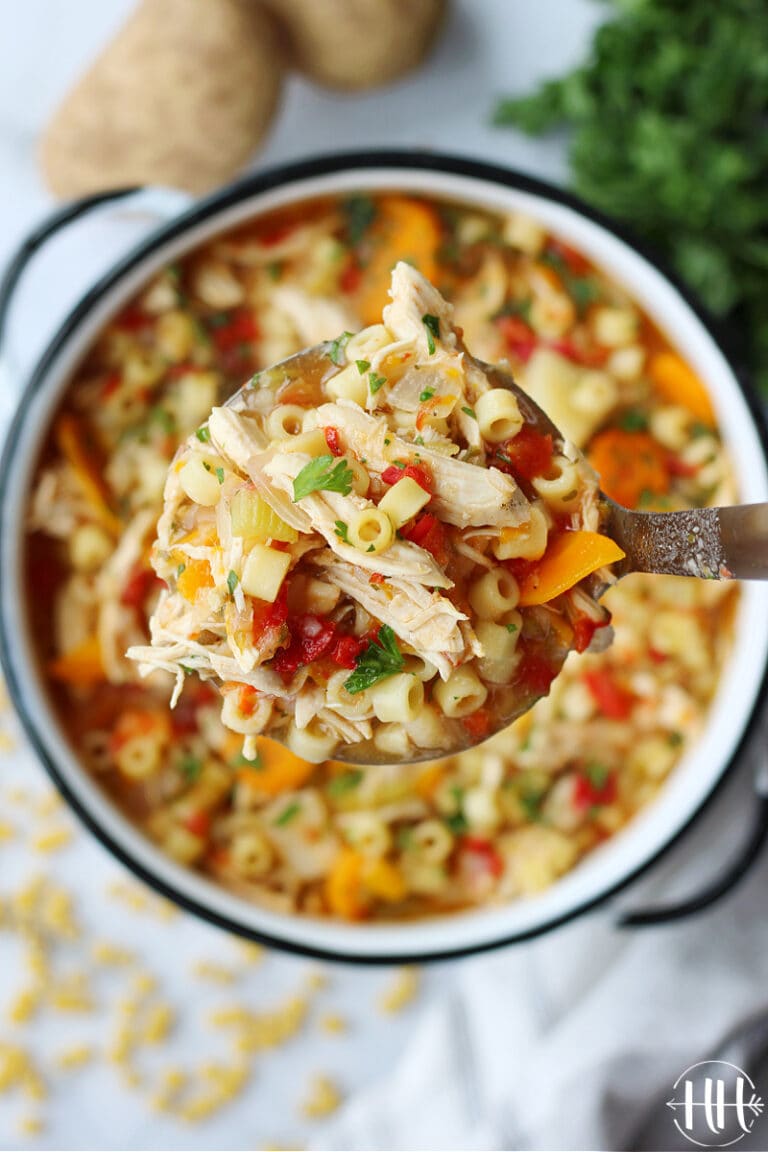 Overhead photo of Sicilian Chicken Soup in a ladle over the pot.