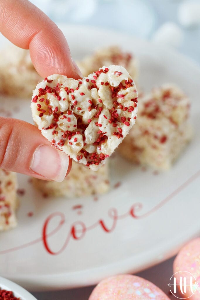 Festive and pretty rice krispies treats cut into hearts with cookie cutters for Valentines Day.