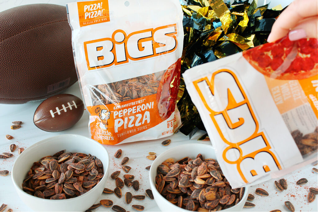 BIGS Little Caesar’s ExtraMostBestest Pepperoni Pizza Sunflower Seeds poured into pretty white bowls for a game day snacks idea.