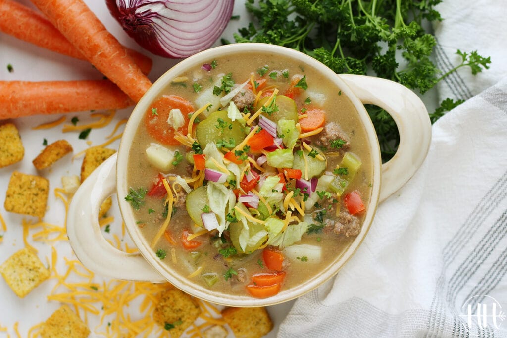 Full bowl of gluten free cheeseburger soup with lots of vegetables. 