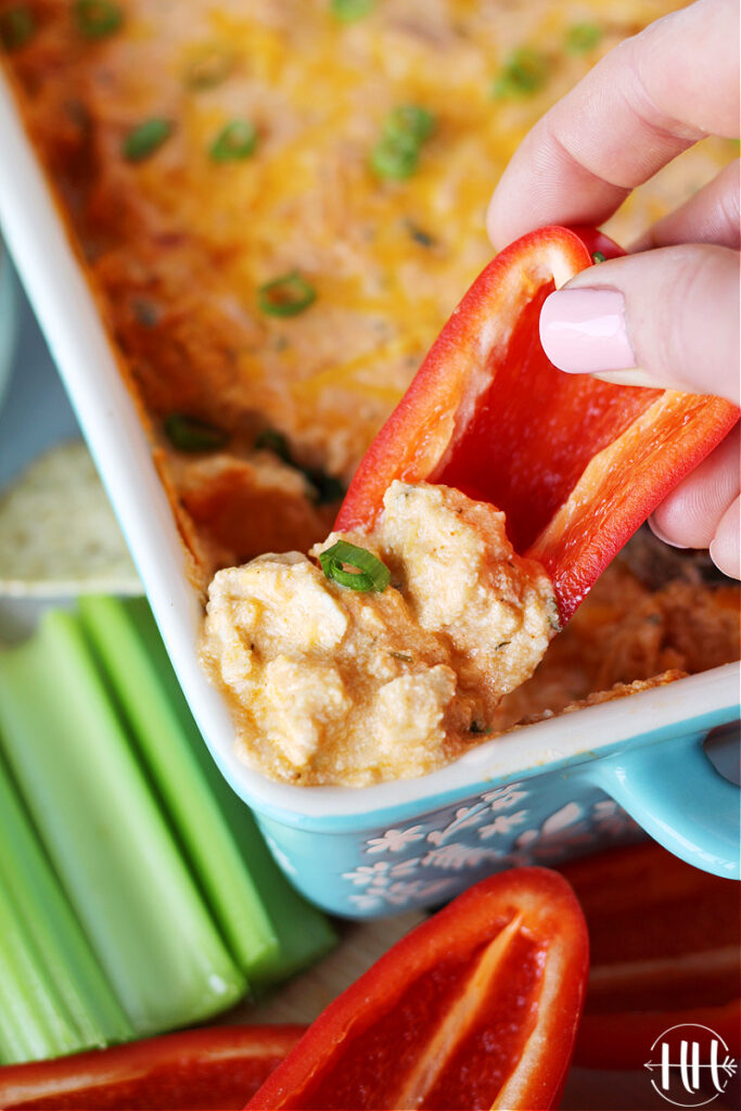 Up close photo of a bell pepper and gluten free buffalo chicken dip. 