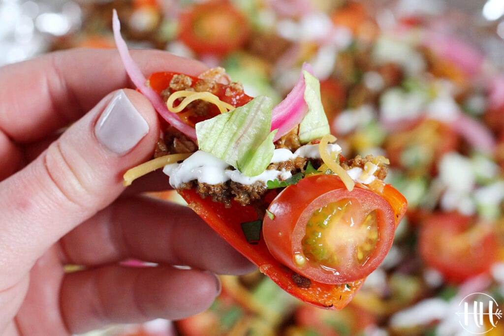 Gluten free red pepper topped with all the healthy nacho fixings.