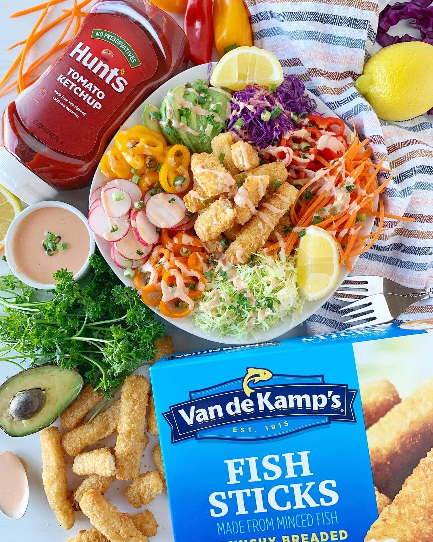 AD | Ohhhh my, do I have a recipe for you! It’s fishtastic.🐟🤩

Lent is here and Van de Kamp’s® Crunchy Breaded Fish Sticks is the answer. They are made from wild-caught Alaskan Pollock and contain 10g of protein/serving. …I usually cook up 2 servings. They are just.that.delish.🤤

And who says fish sticks are for kids? Not me! It’s a family affair here, you’re never too young or old for them. 

Every ingredient for this pretty Fish Stick Bowl can be found @walmart. I use their app to order groceries every week. Soooo convenient!

◻️Ingredients◻️
▫️Van de Kamp’s® Crunchy Breaded Fish Sticks
▫️Shredded carrots
▫️Sliced radish
▫️Purple and green cabbage, sliced thinly 
▫️Green onion, 
▫️Avocados, sliced 
▫️Mini bell peppers, sliced and deseeded
▫️Lemon wedge, optional but I love to spritz over the salad 
▫️Parsley sprinkled about 

◻️Yum Yum Sauce Ingredients◻️
▫️1/4 cup Mayo
▫️1 Tbsp + 1 tsp Hunt's Ketchup
▫️1/4 tsp sugar
▫️1/8 tsp paprika 
▫️1/8 tsp garlic 
▫️1/32 tsp cayenne (basically a little itty bitty bit! Lol)
▫️2 tsp water 
Mix all ingredients together in small bowl. Makes enough for 2 servings. 

I bake the fish sticks in my air fryer, but oven directions are on the box too! Place as many veggies as you like in a bowl and top with warm fish sticks. Drizzle Fish Stick Bowl with yum yum sauce and a squeeze of the lemon wedge.

Trust me, you are going to want to run NOT walk to grab these Fish Stick Bowl ingredients. Happy eating!

Order HERE: https://2cart.net/10640003 OR click link @happihomemade👈🏼