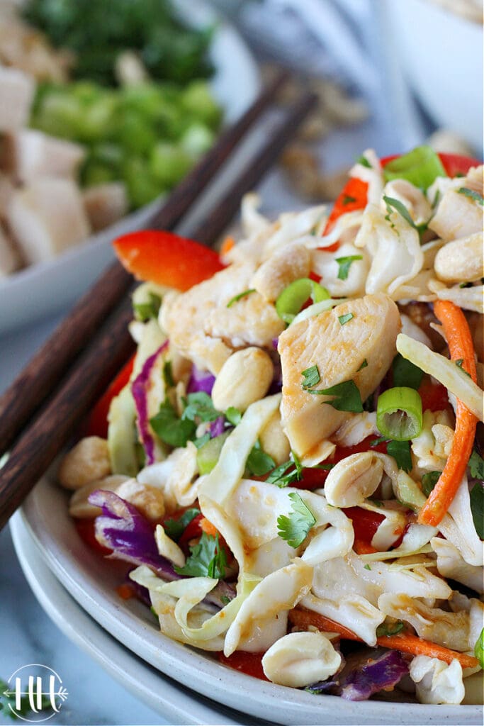 Diced chicken breast and chopped cilantro atop bagged coleslaw blend.