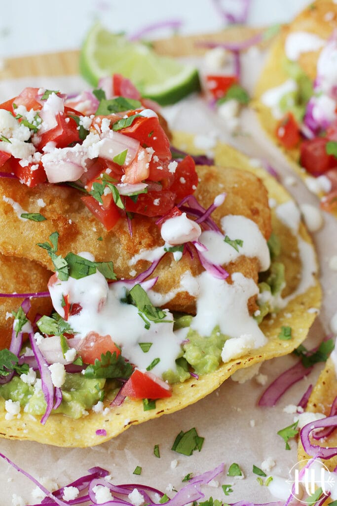 Breaded fish fillet with pico de gallo and clean eating lime crema.