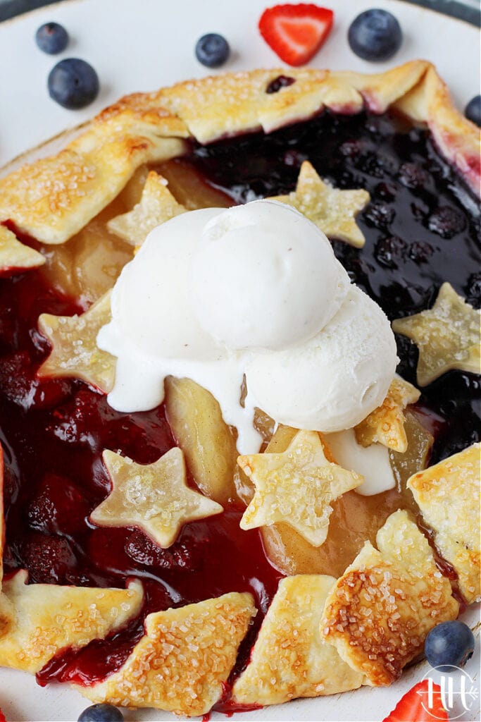 Melted vanilla ice cream on a red white and blue galette.