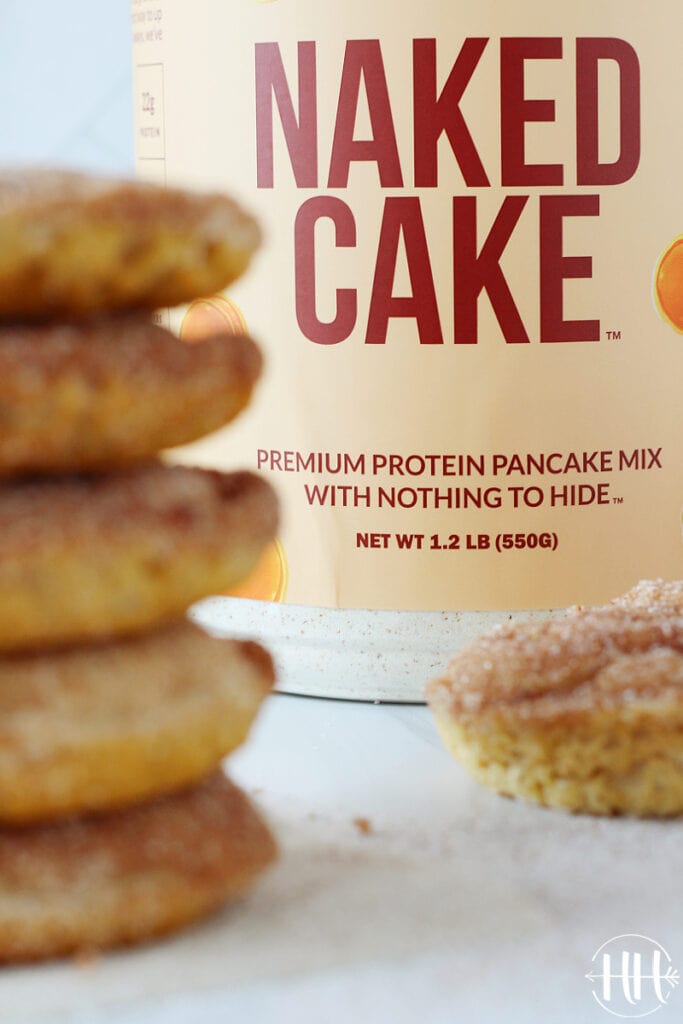 Naked Cake container with gluten free cinnamon and sugar protein donuts.