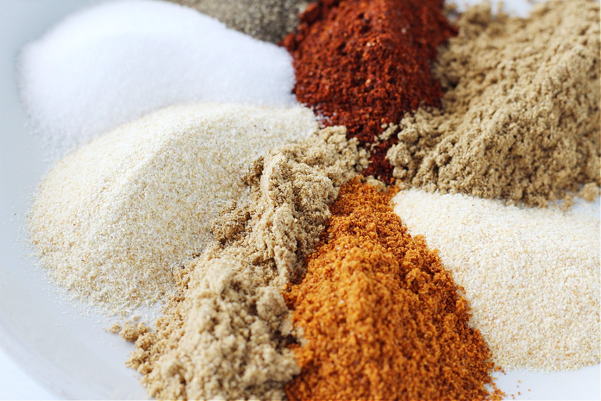 Up close photo of DIY taco seasoning ingredients on a plate.