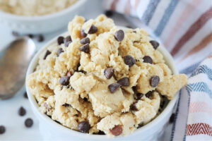 Up close photo of chocolate chips in raw edible cookie dough.