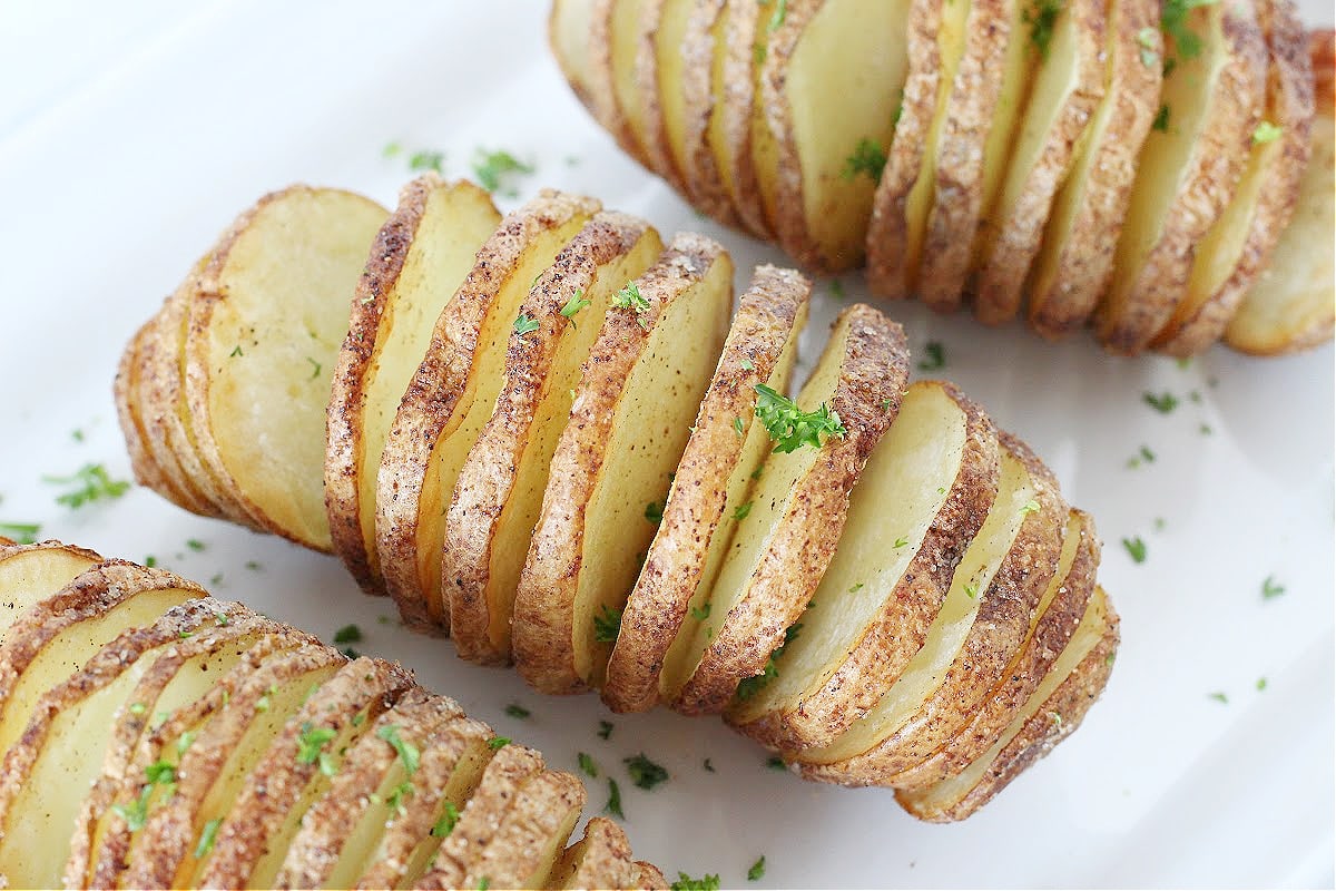 Three air fried hasselback potatoes.