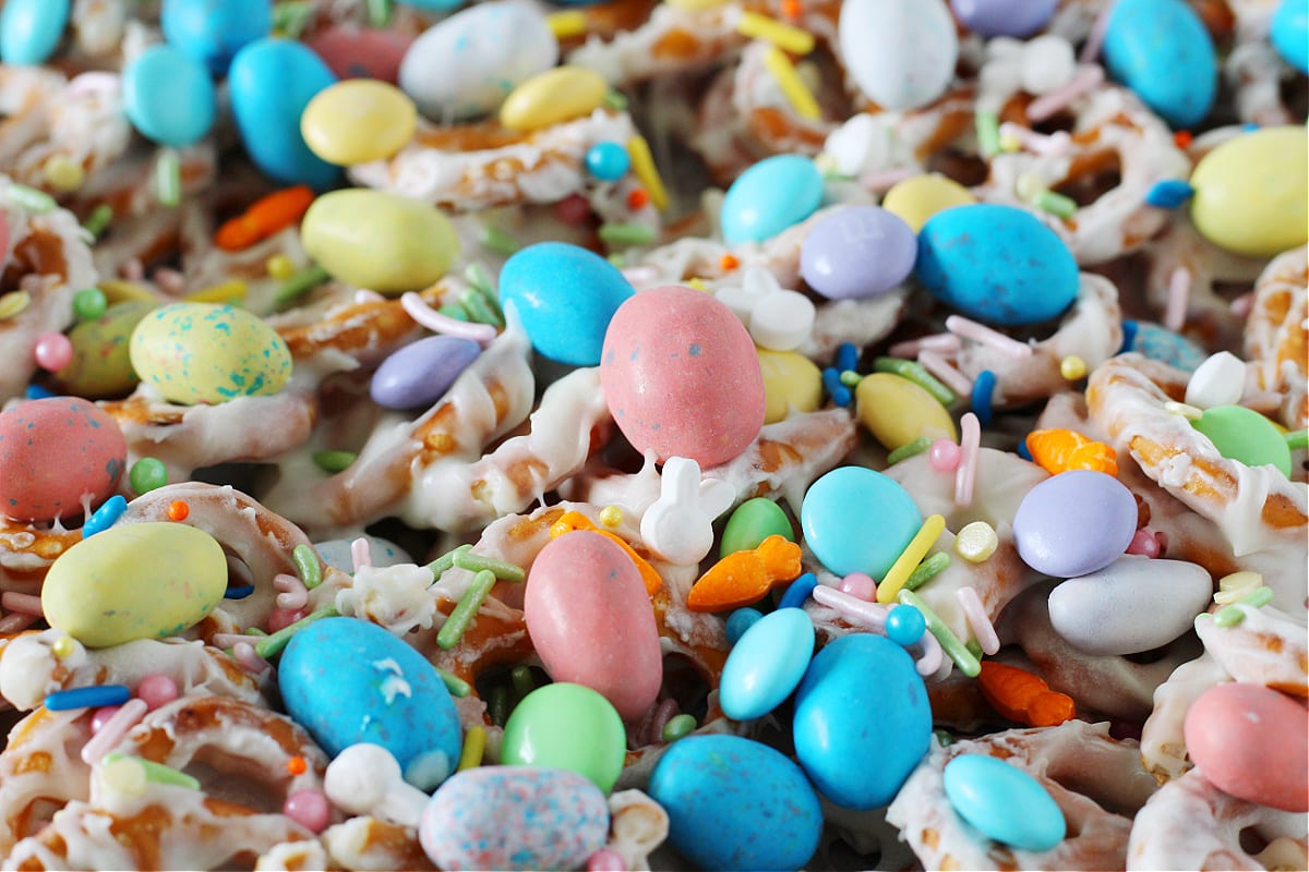 Up close photo of Easter White Chocolate Pretzel Bark with pastel M&Ms and sprinkles.