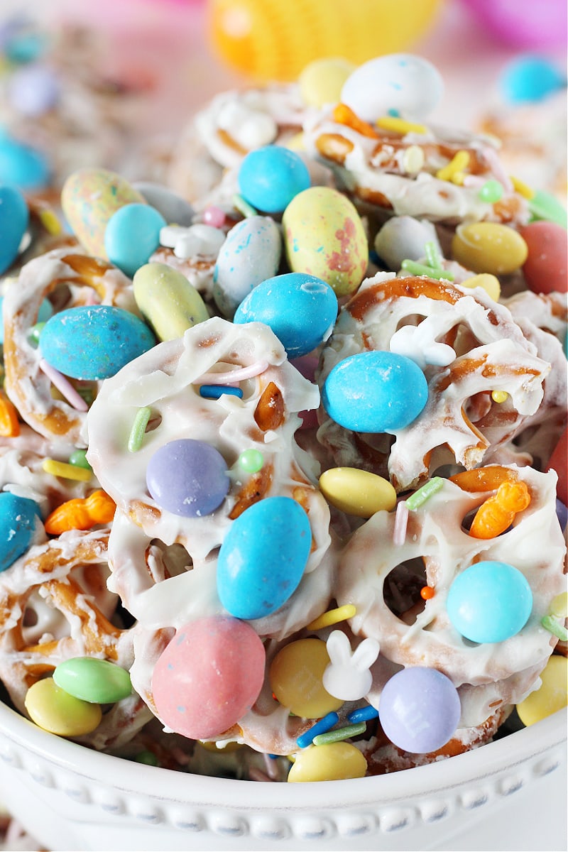 Easter White Chocolate Pretzel Bark with M&Ms piled high in a white bowl.