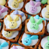 Up close Easter bunny pretzels with bunny faces on the pastel M&Ms.