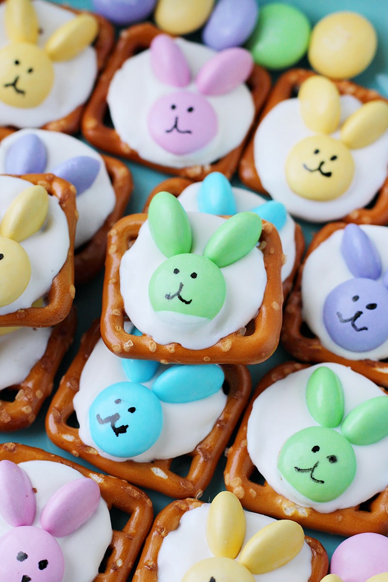 Up close photo of Easter Bunny Pretzel Treats with pastel M&Ms and bunny faces.