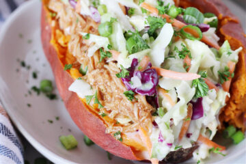 Up close photo of a BBQ Chicken Stuffed Sweet Potato garnished with green onion.