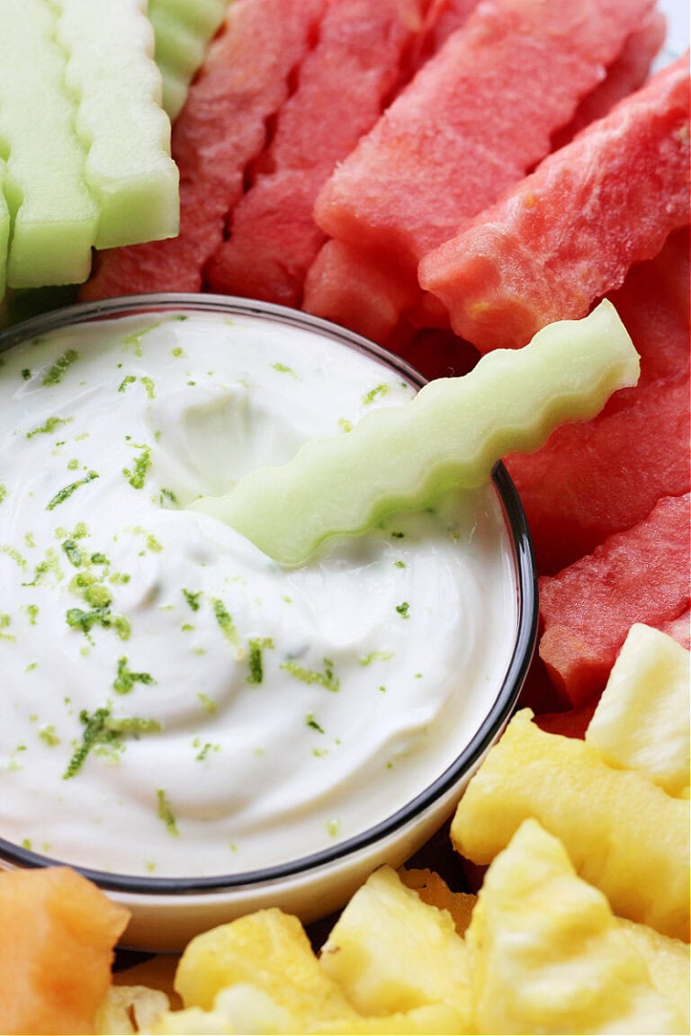 A honeydew melon crinkle cut fry dipped in vanilla lime yogurt dip.