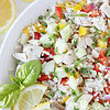 A cold rice salad with diced chicken, vegetables with a lemon sauce.