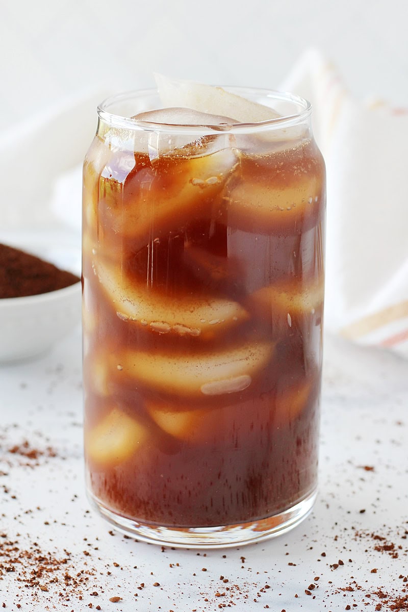 A tall glass of homemade cold brew with ice cubes.