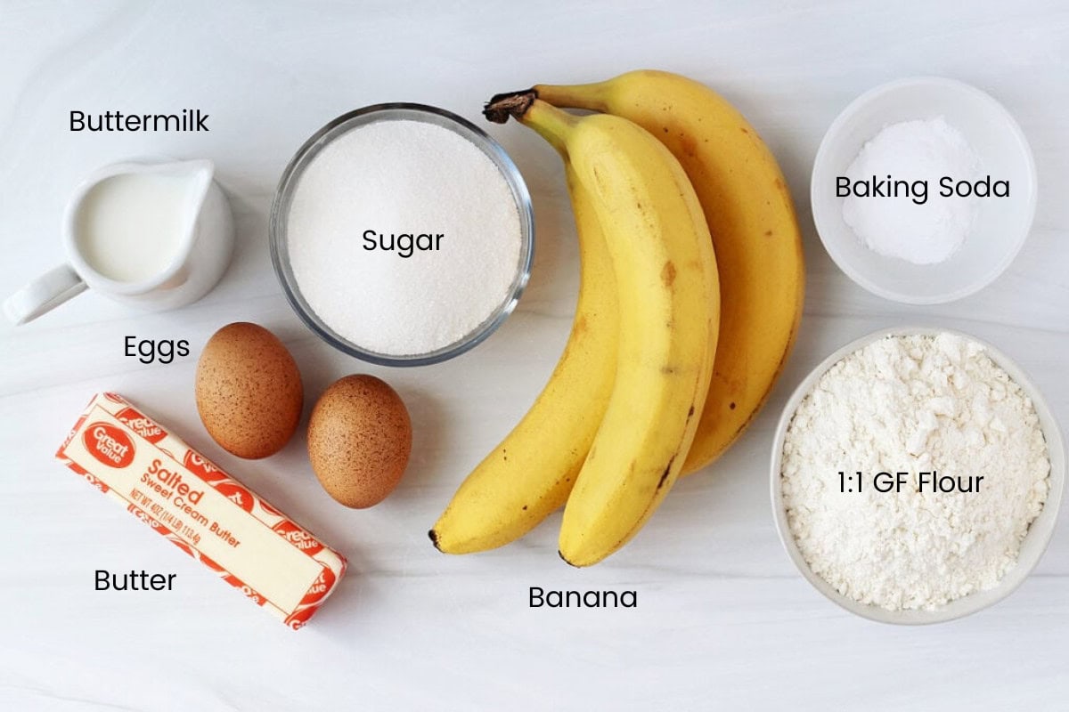 Labeled ingredients for gluten free banana bread with buttermilk on a white countertop.