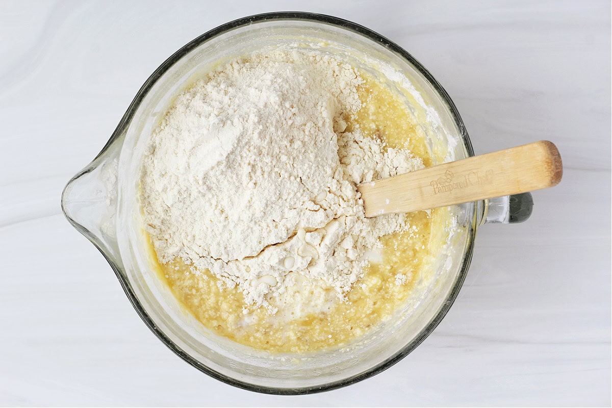 Overhead photo of more flour mixture on top of the batter.