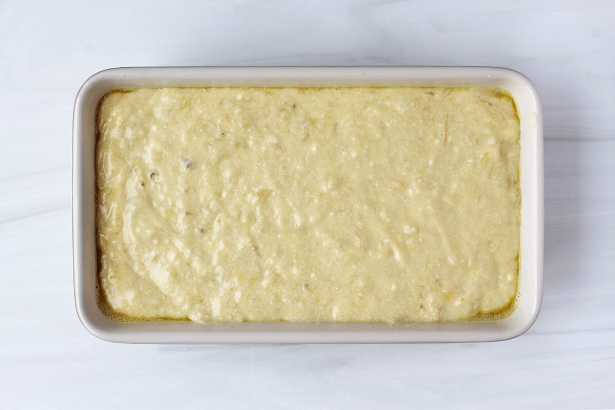 Overhead photo of banana bread batter in a loaf pan.